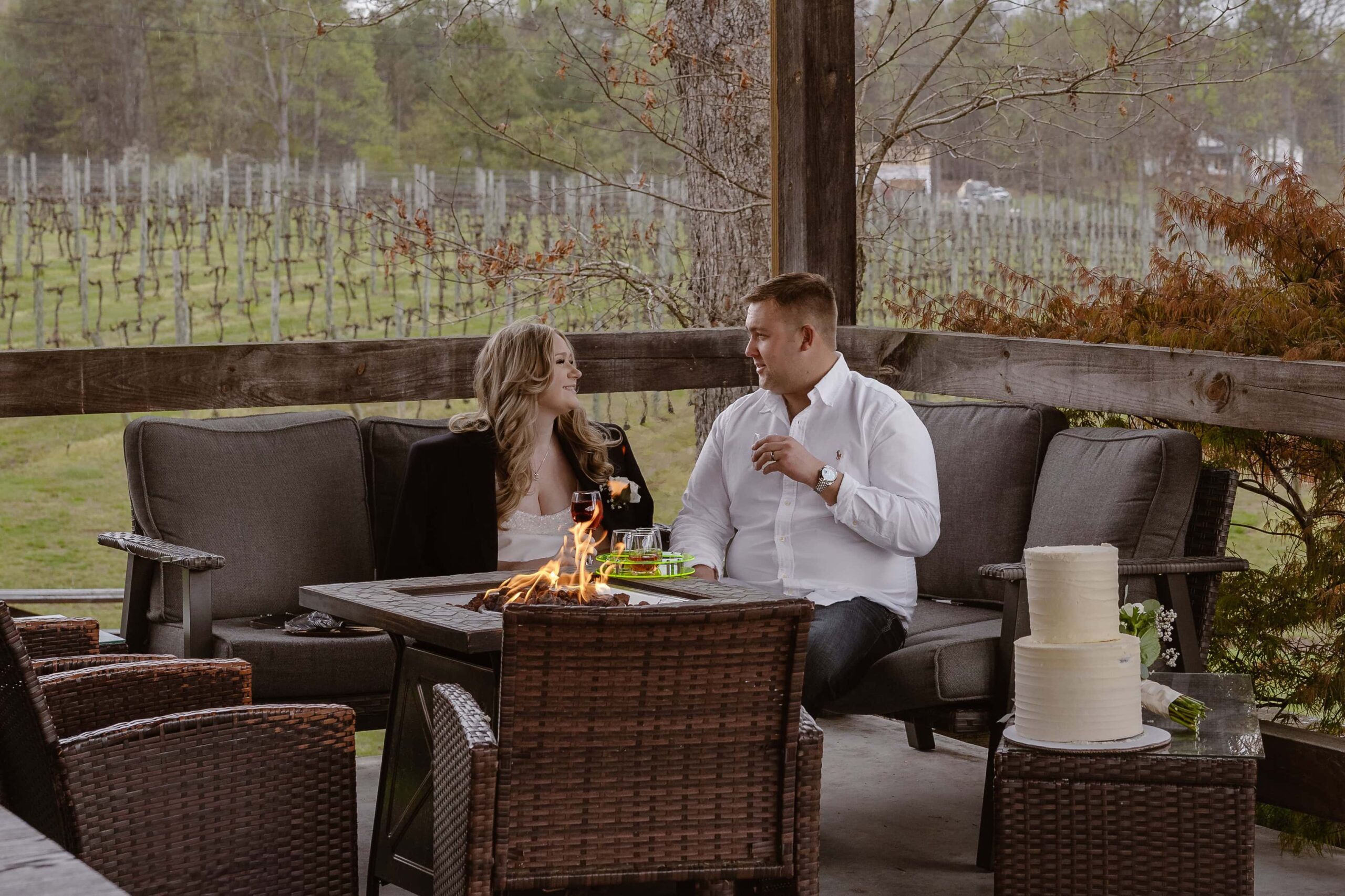 couple share wine and snacks during their winey elopement