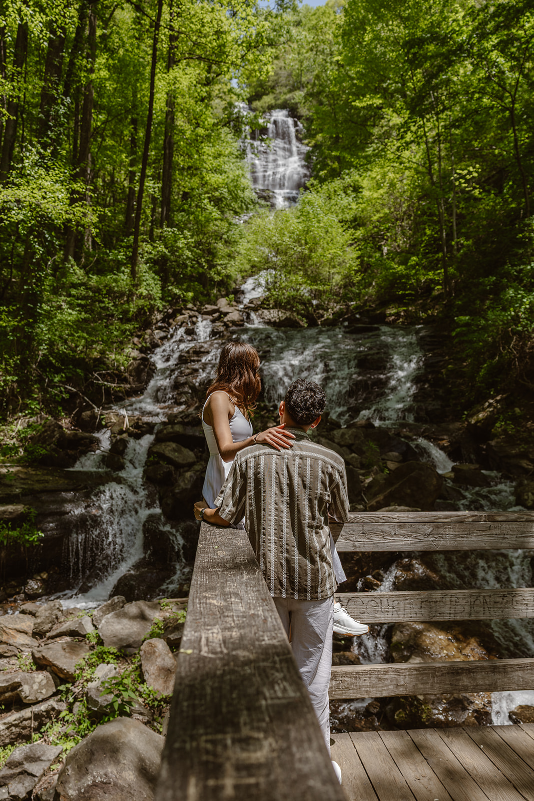 bride and groom have a picnic on the overlook