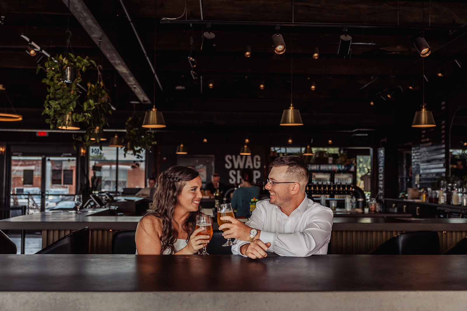 stunning bride and groom share intimate moments during their unique bar elopement