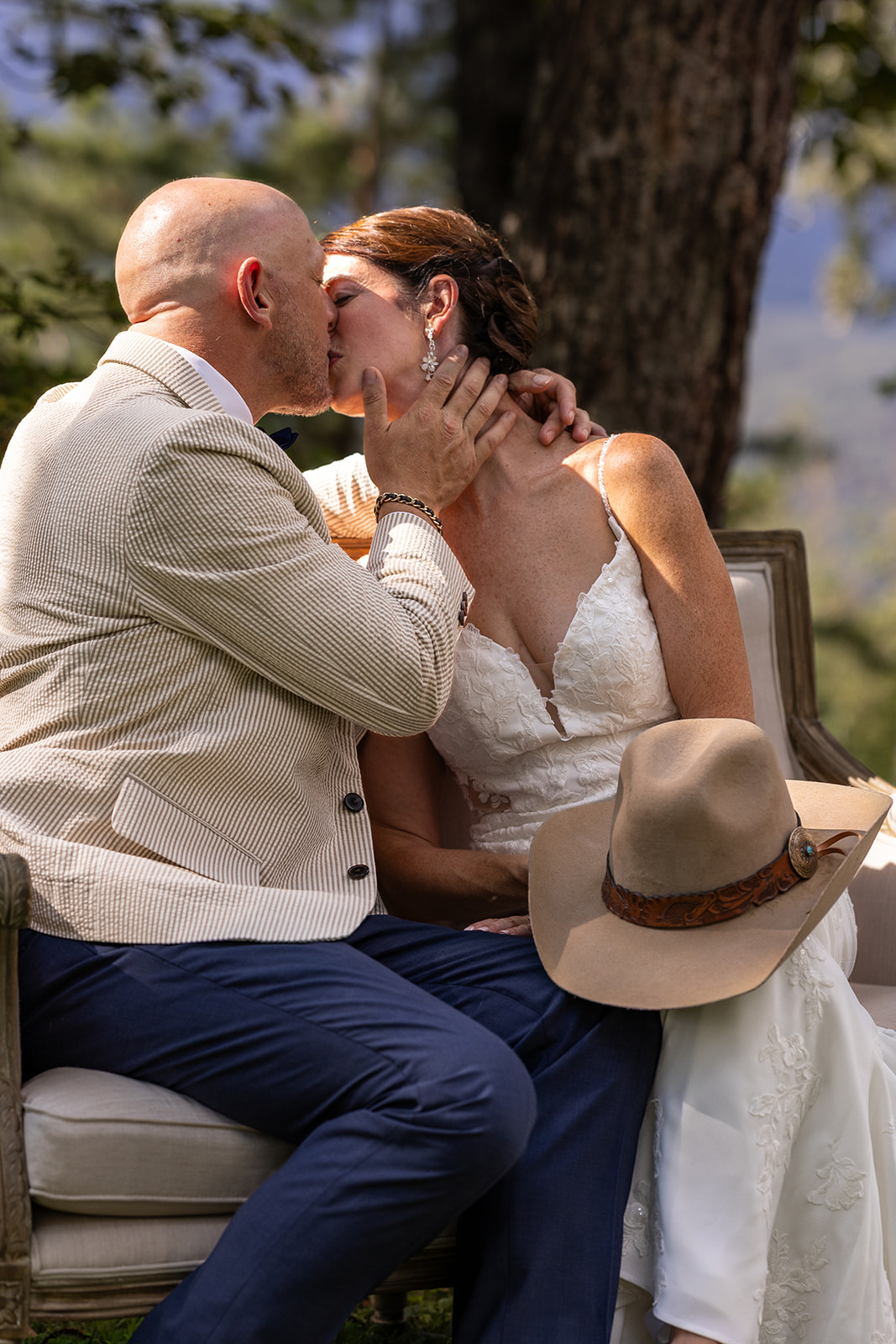 bride and groom share a kiss at the end of airbnb mountain elopement