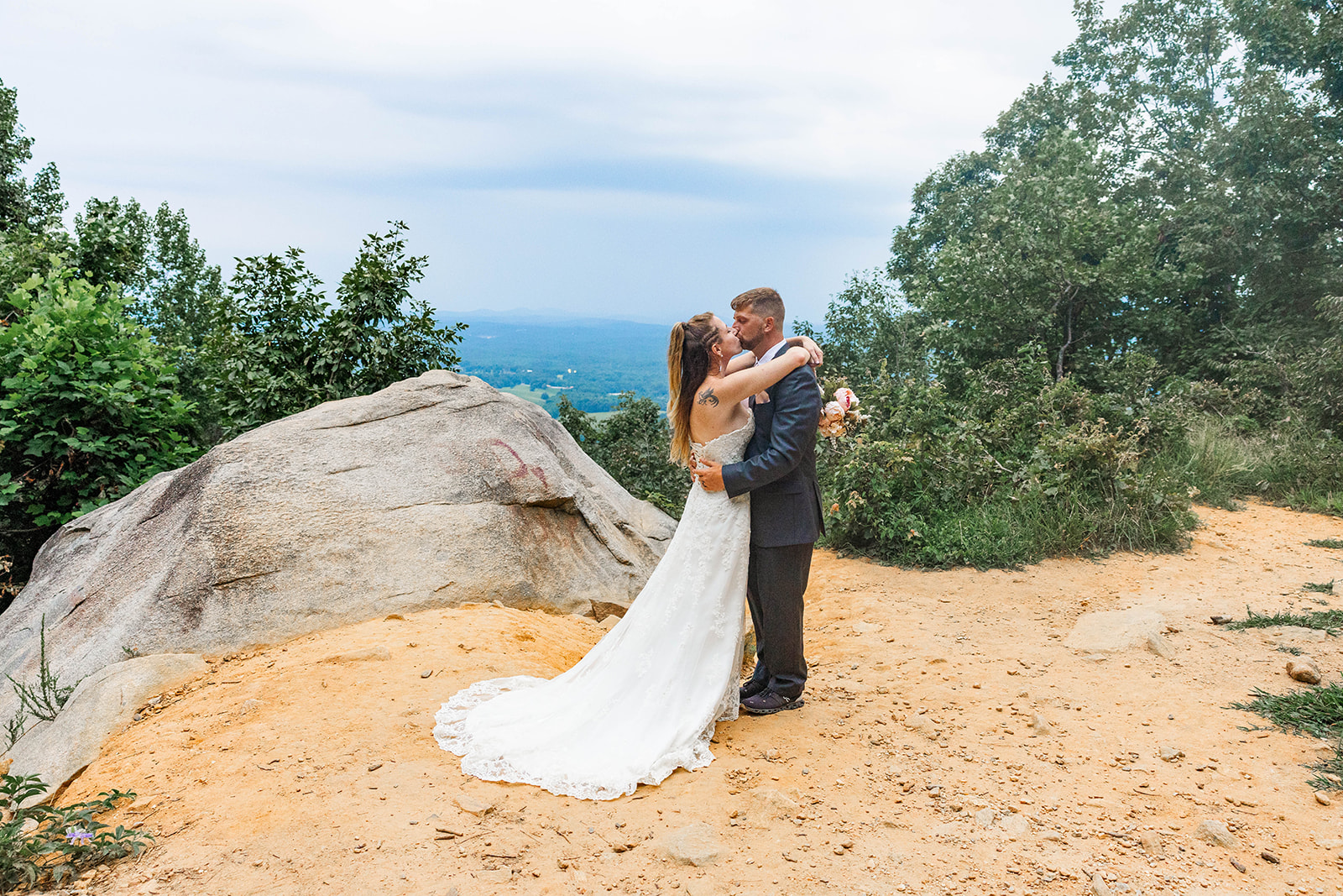 bride and groom share an intimate moment overlooking the valley