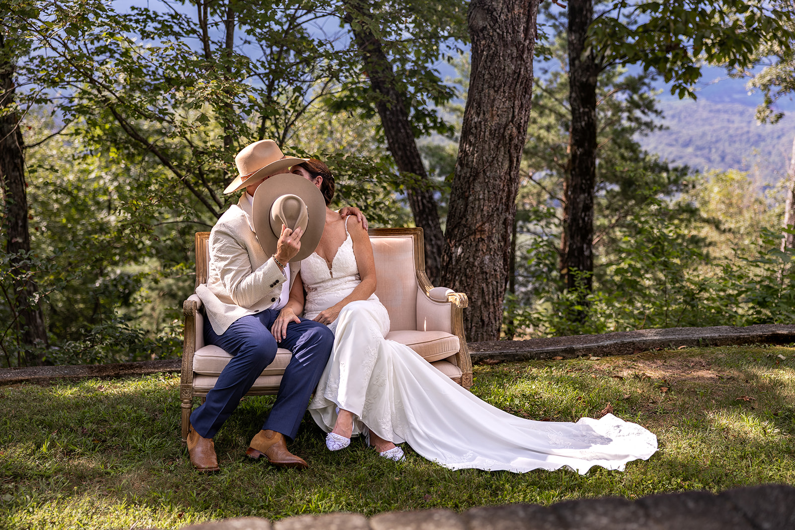 bride and groom share a kiss at the end of airbnb mountain elopement