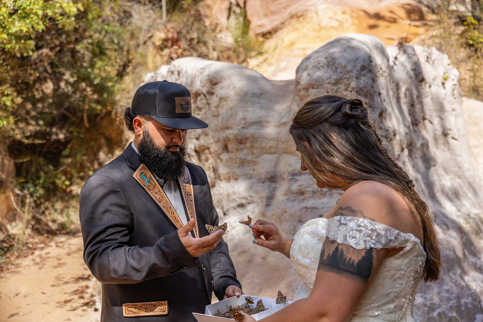 bride and groom release a box of butterflies 