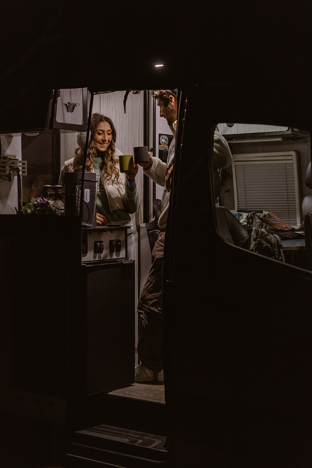 couple share romantic moments in their camper van during their Asheville elopement 