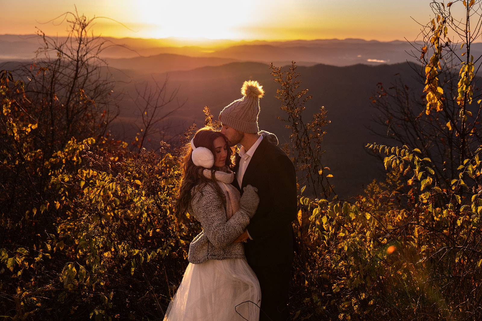couple share romantic moments on the edge of the mountains during their Asheville elopement
