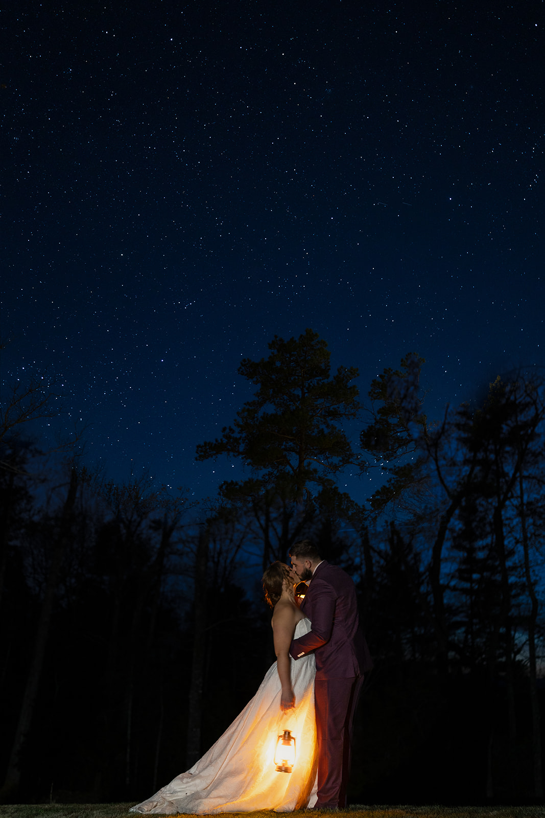 bride and groom close out their elopement timeline with a lantern and star photo