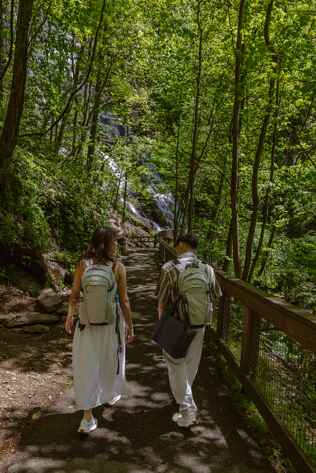 couple approach the waterfall they selected to elope at!