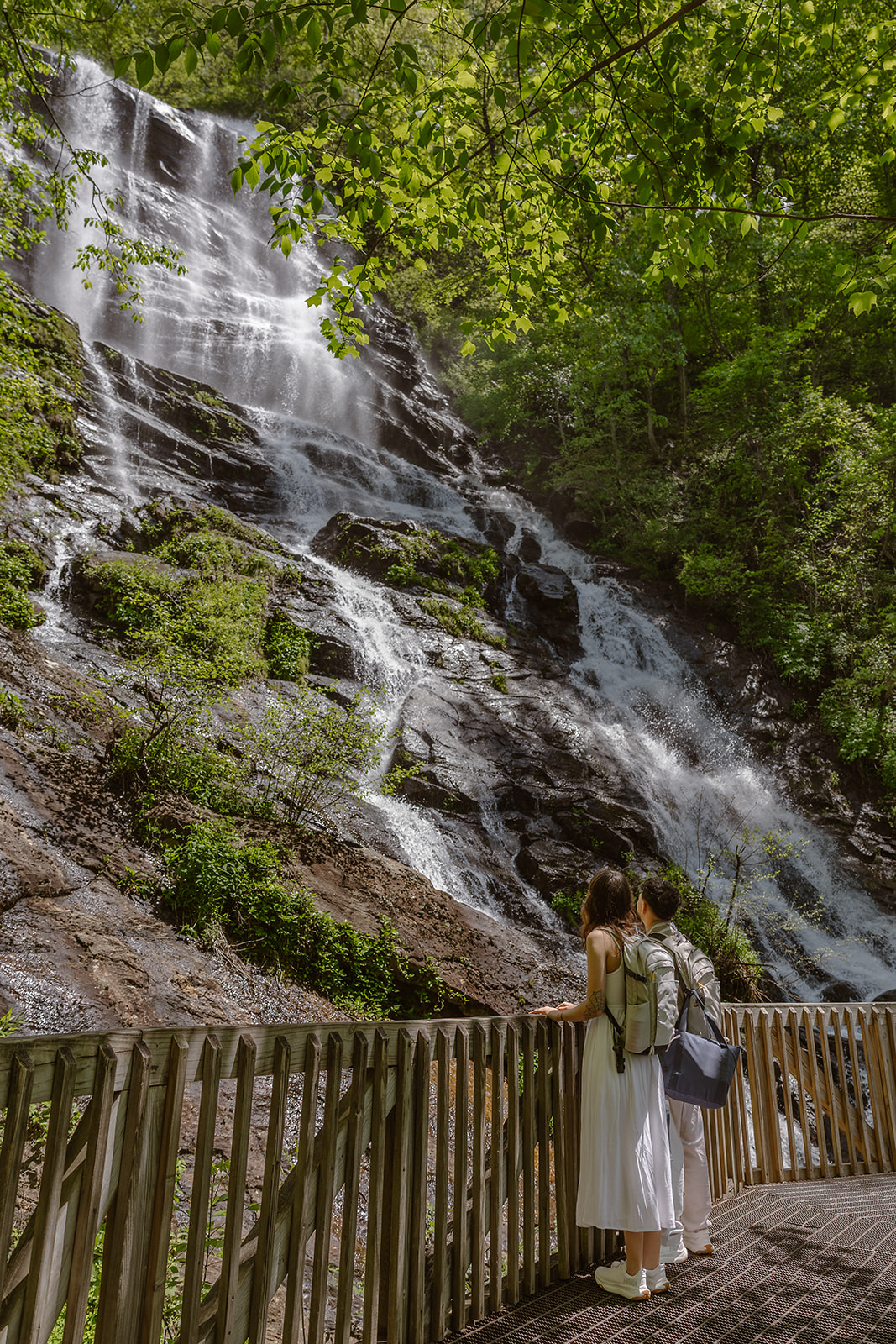 couple approach the waterfall they selected to elope at!