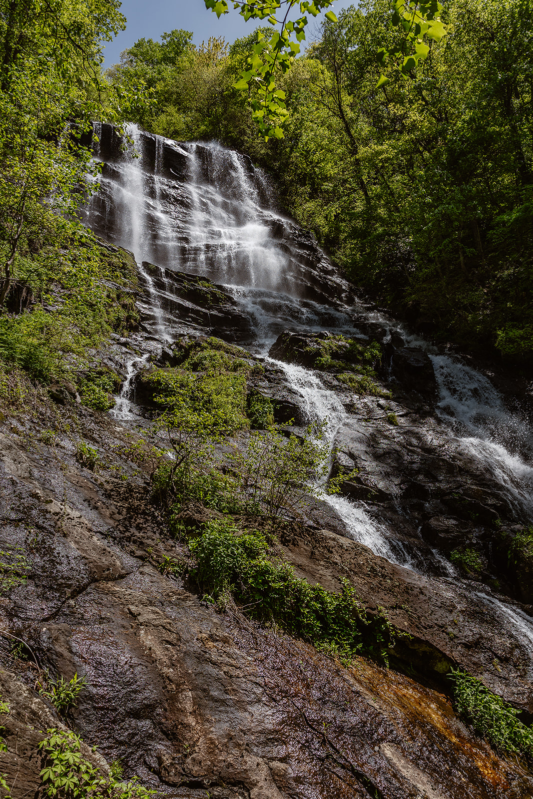 waterfall cascades down the rockface 