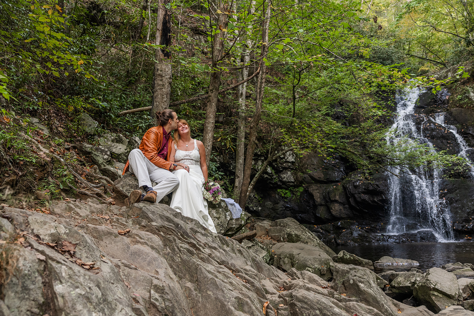 bride and groom pose for a photo together