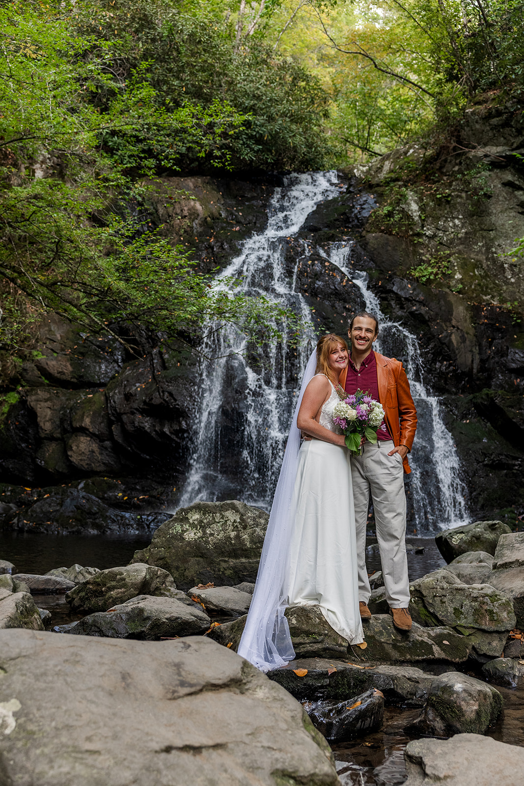 bride and groom pose for a photo together