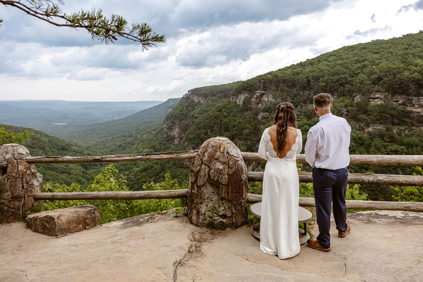beautiful couple look out at the stunning North Georgia mountains