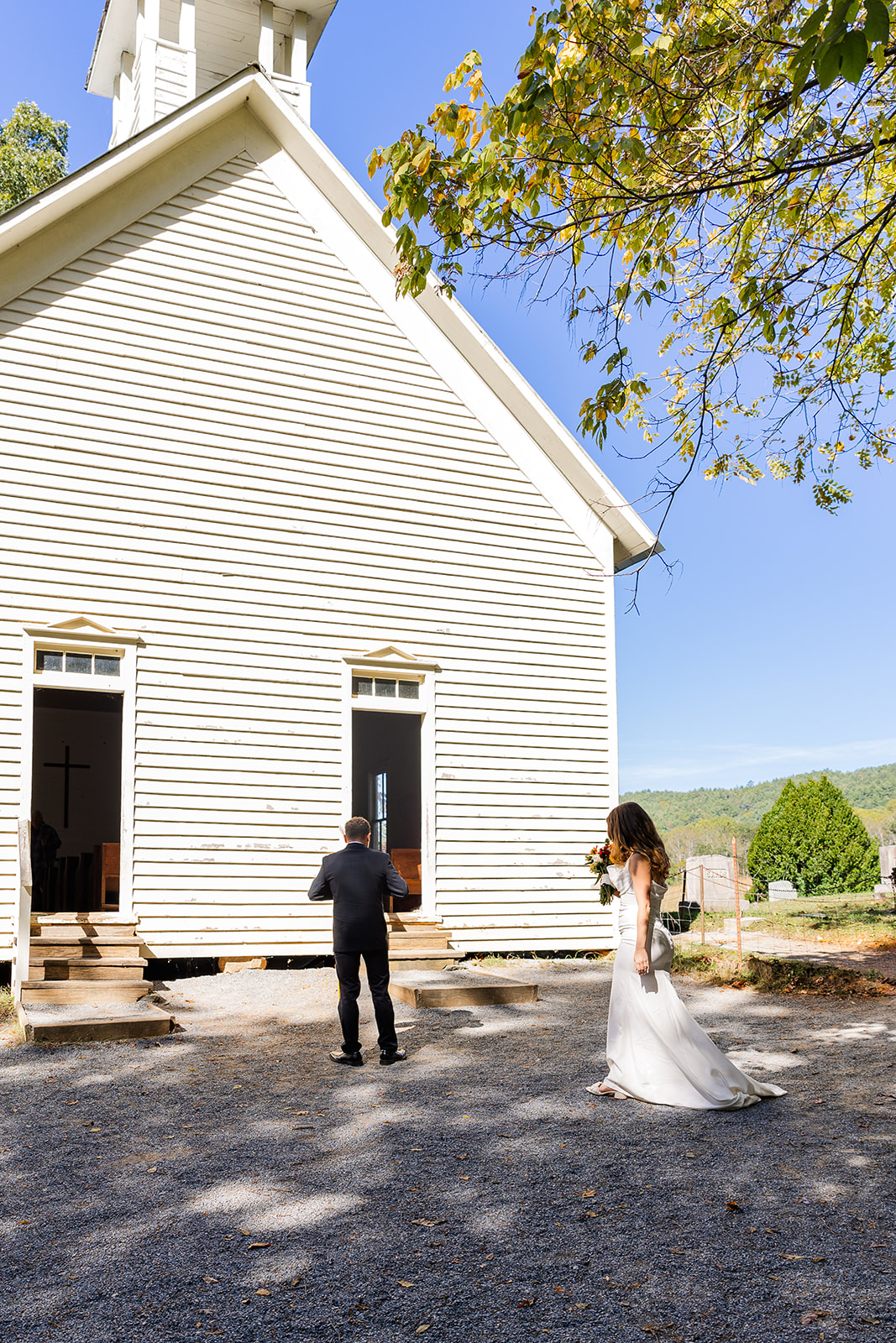 stunning couple during their emotional first look photos right outside the chapel during their cades cove elopement