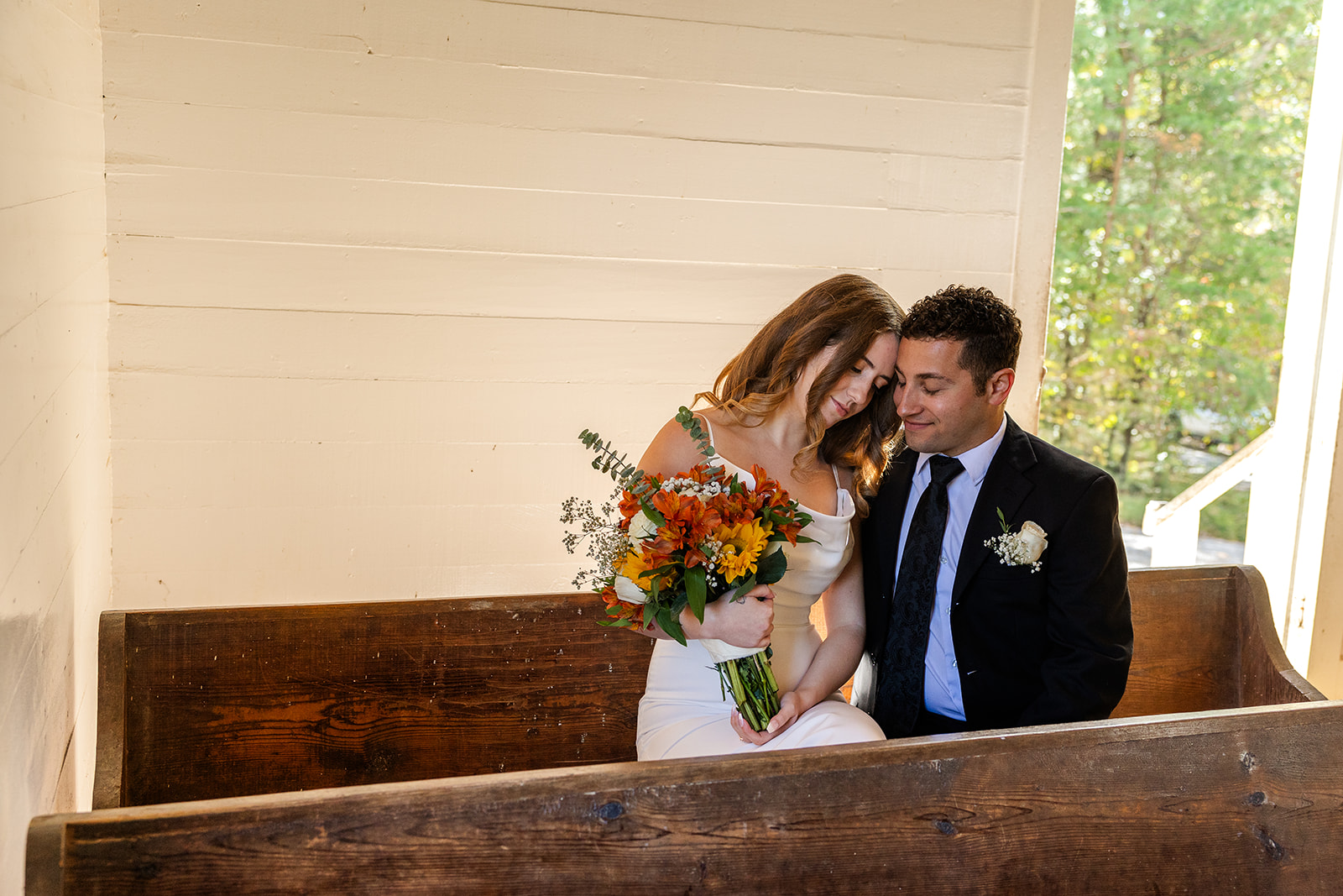 couple share a moment together in the chapel during their cades cove elopement