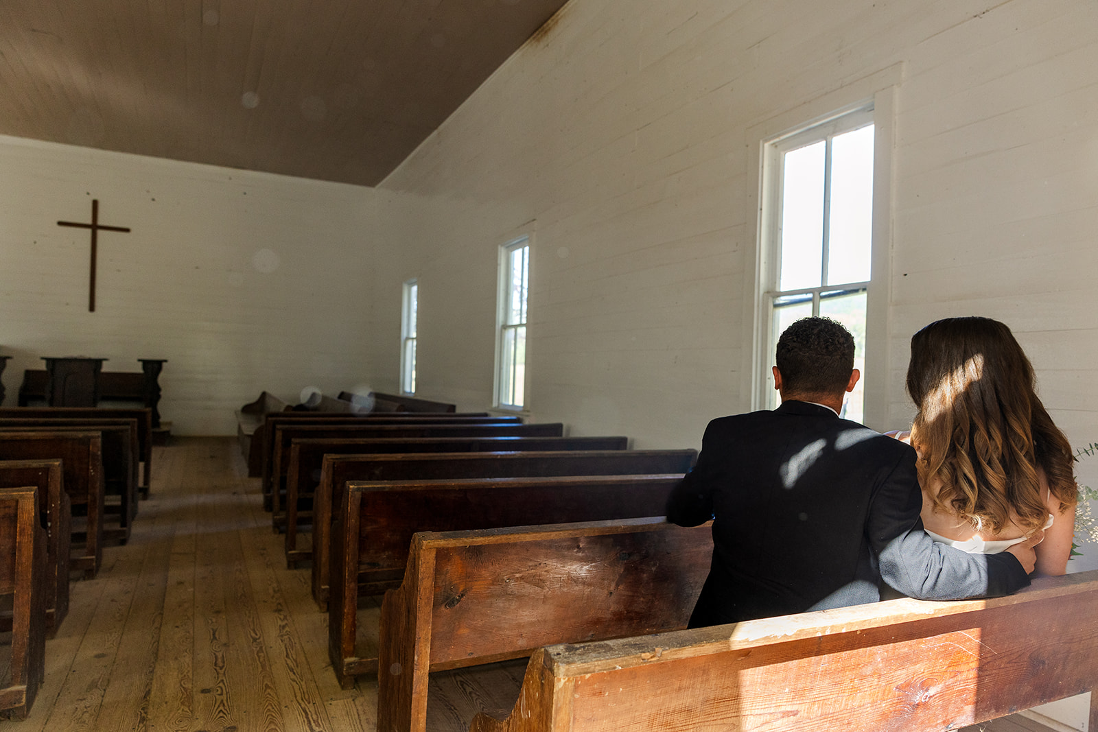 couple share a moment together in the chapel during their cades cove elopement
