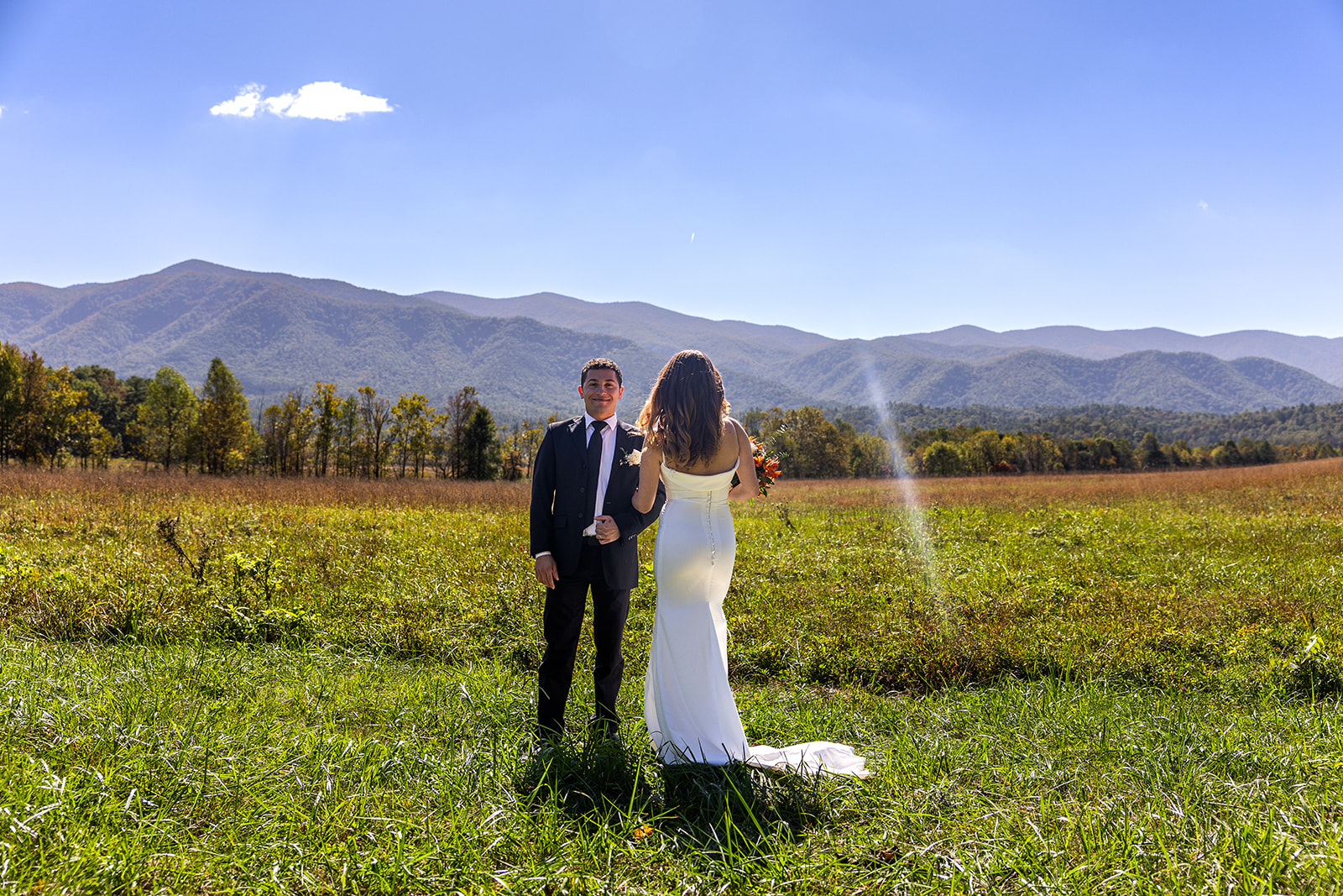 bride and groom pose together on the cades cove elopement day